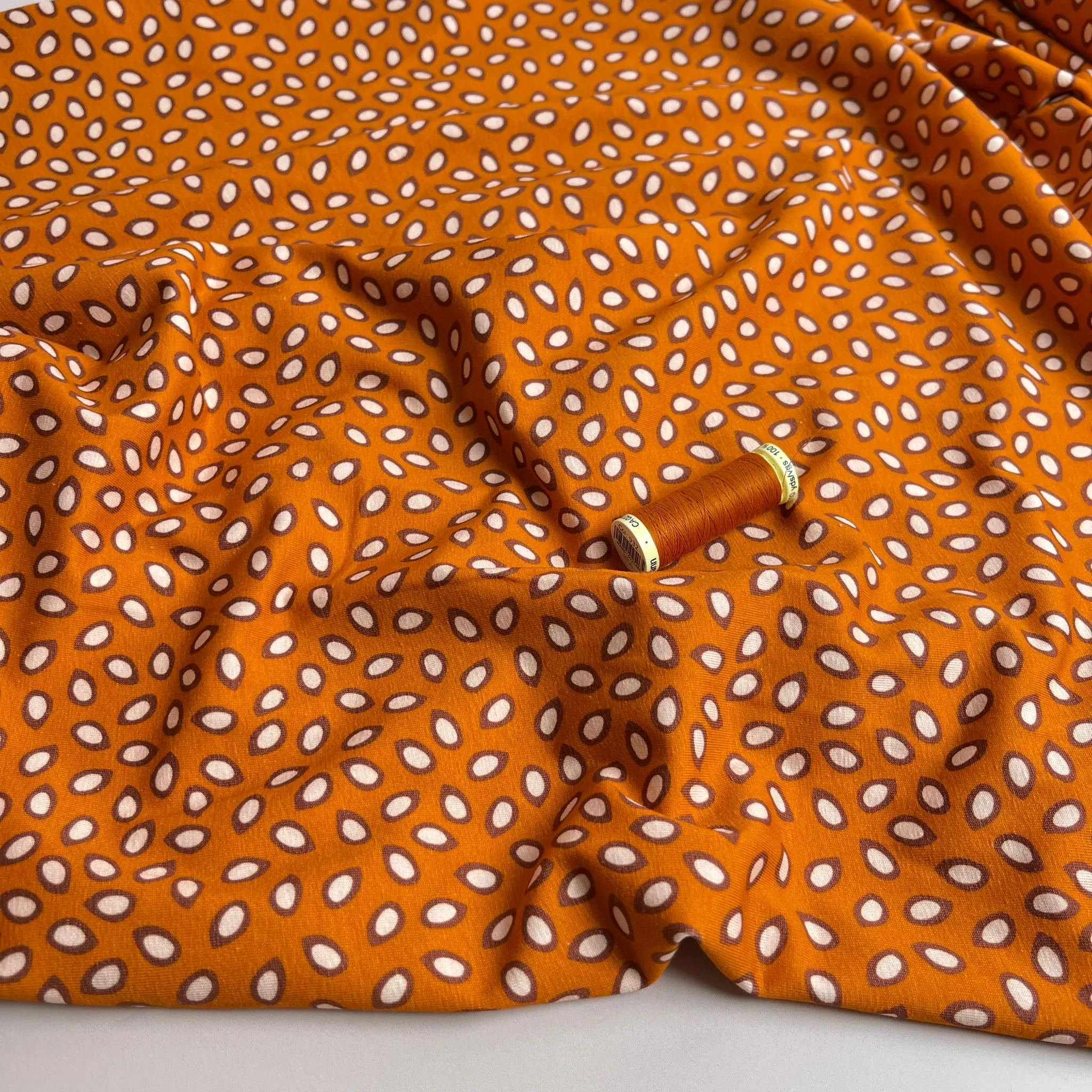 Danish Design - Small Petals on Rust Cotton Jersey Fabric